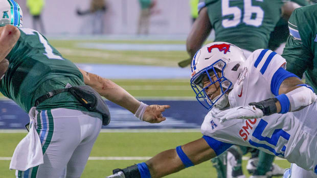 Ponies' Cameron Robertson dives at Tulane quarterback Michael Pratt in AAC title game